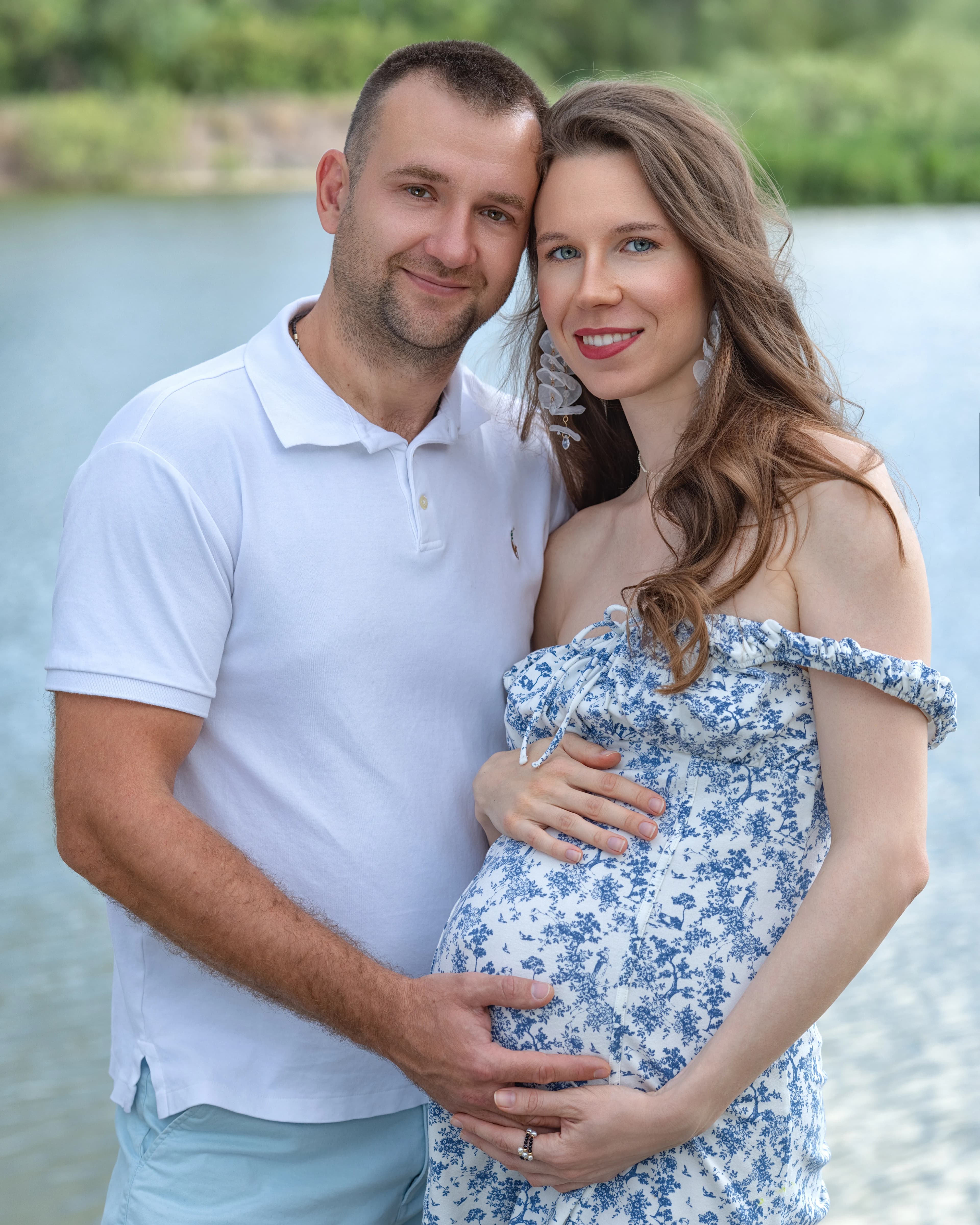 Maternity couple portrait by lake