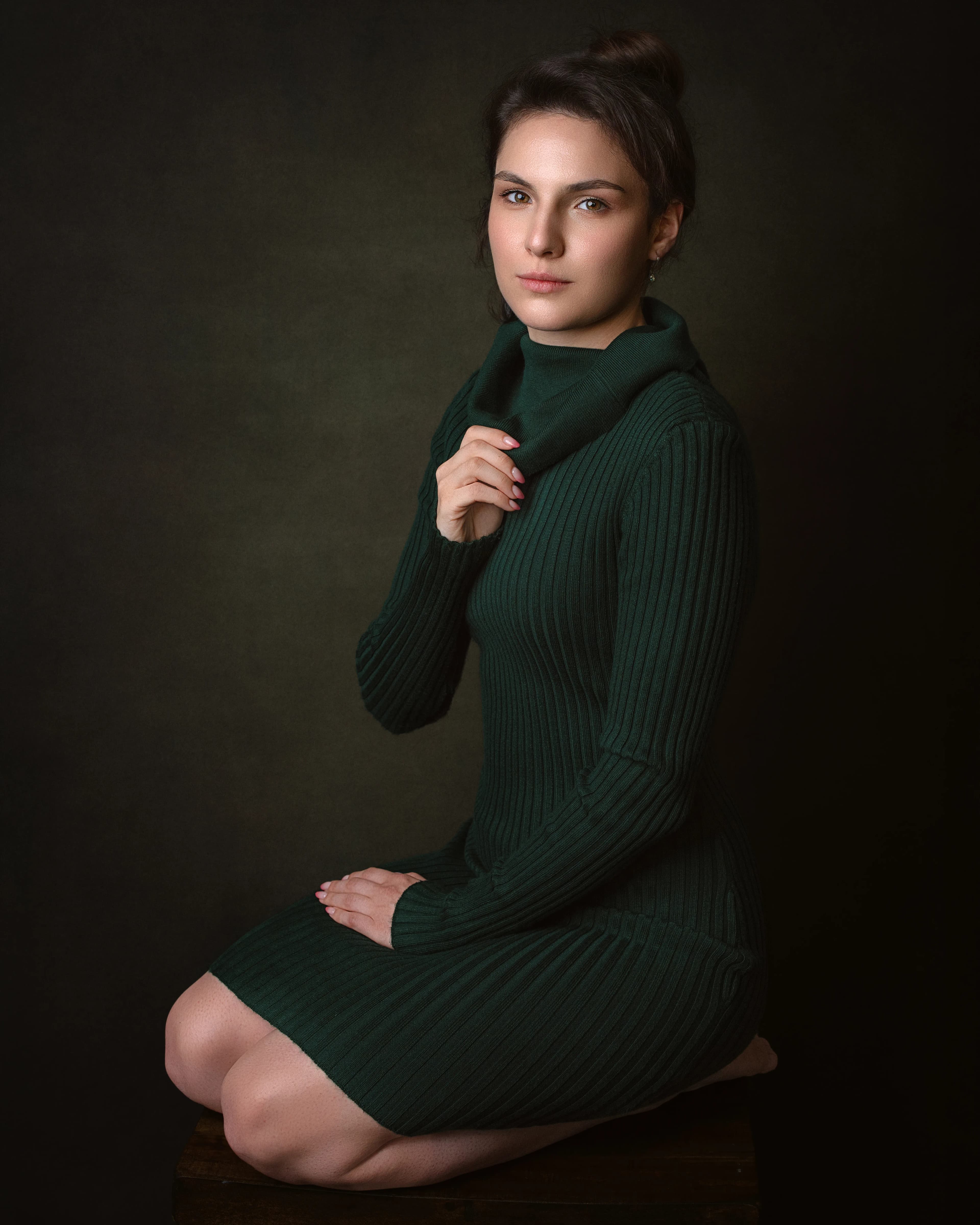 Fine art portrait of a woman dressed in green sweater