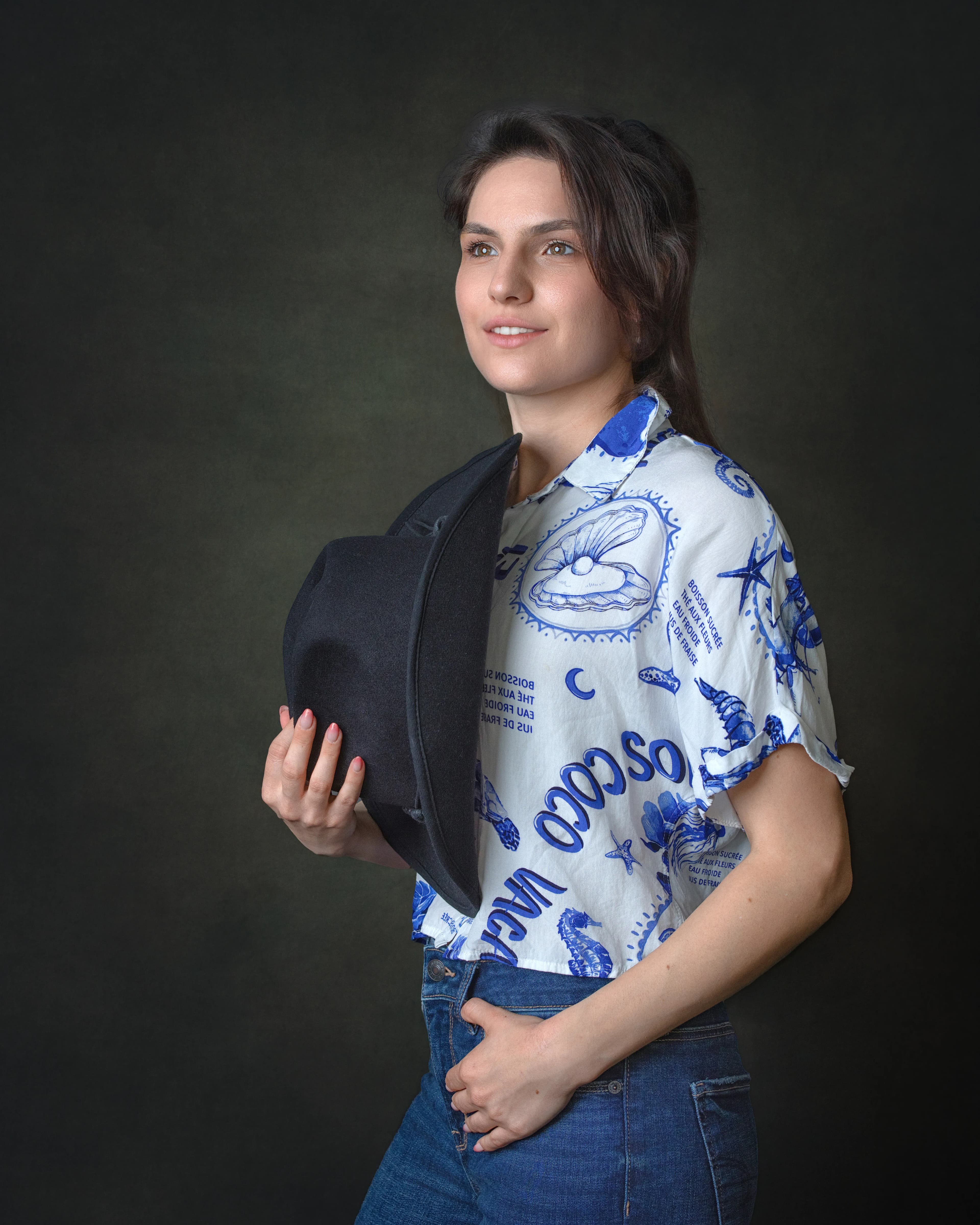 Studio fashion portrait woman side profile hat