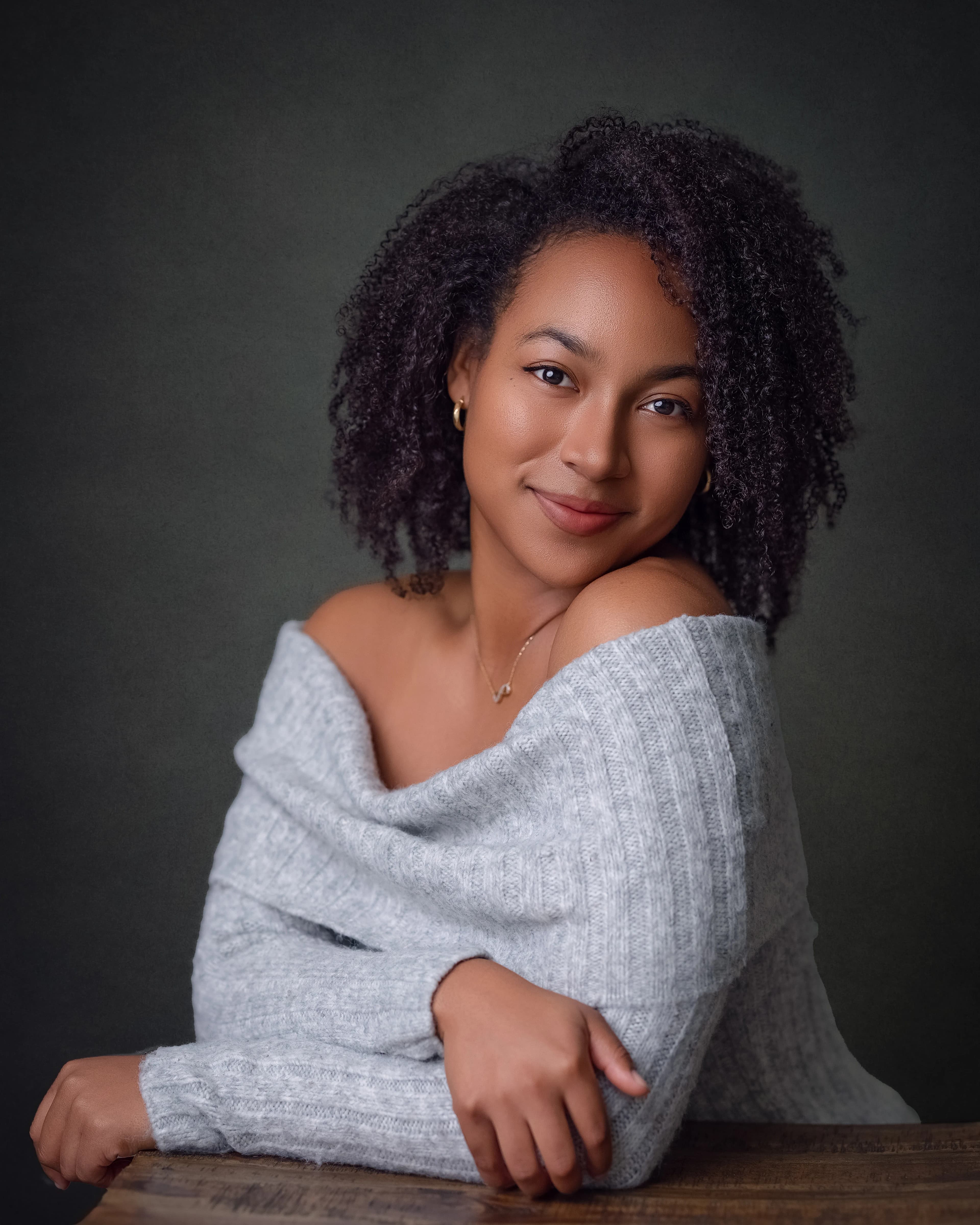 Studio portrait woman grey off shoulder sweater